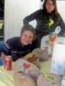 Carolina and Cameron of Alpine Boy and Girl Scouts pose in front of artistic eco rocks at Alpine's Earth Days East